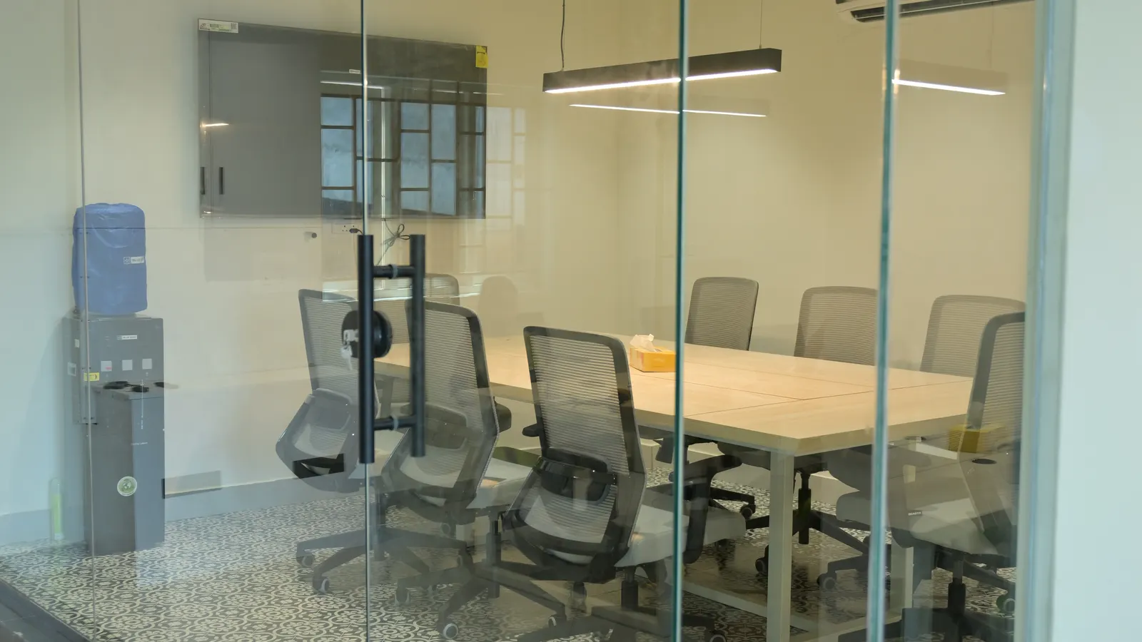 Conference room behind its glass wall